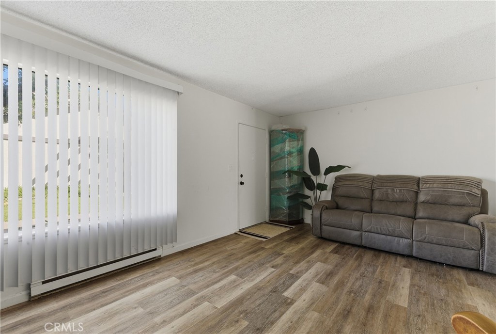 7085 Fulton Way Stanton, CA 90680 - Photo 9 of 34 a living room with furniture and a window