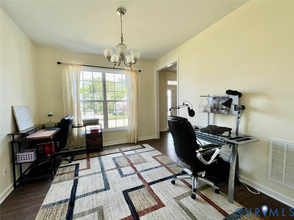 9506 Simonsville Road Midlothian, VA 23112 - Photo 7 of 27 a view of a workspace with furniture and a window