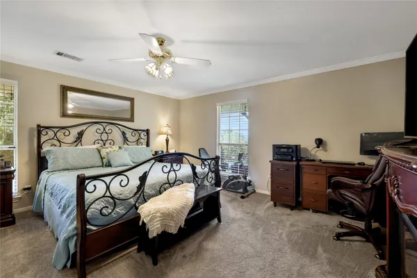 a bedroom with furniture and a window