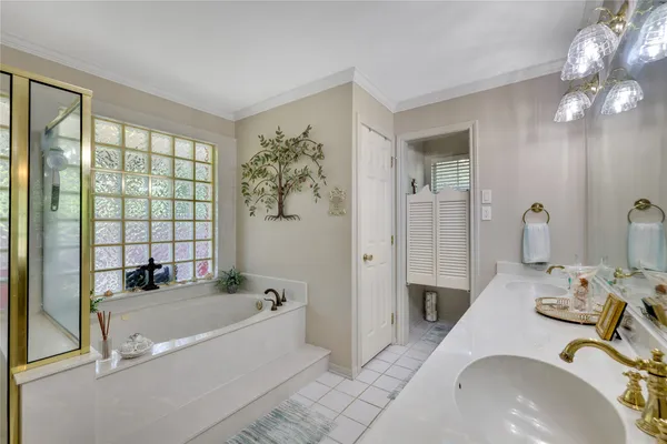 a bathroom with a tub sink and mirror