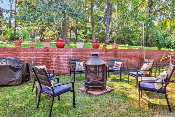 a backyard of a house with outdoor seating