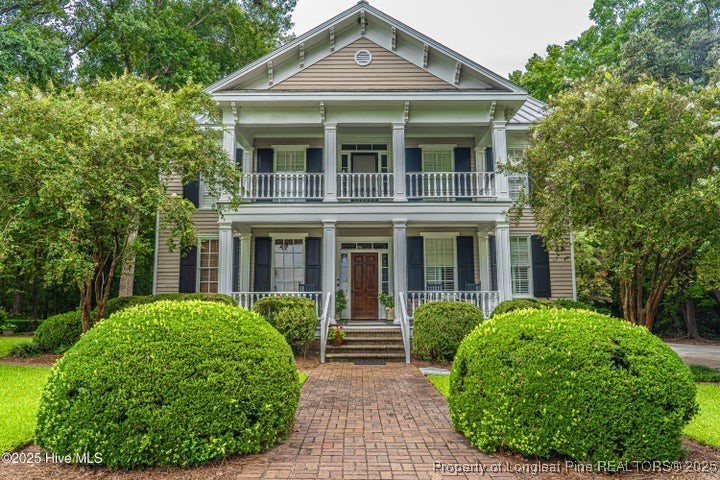 11102 Old Johns Road Laurinburg, NC 28352 - Photo 2 of 42 a front view of a house with garden