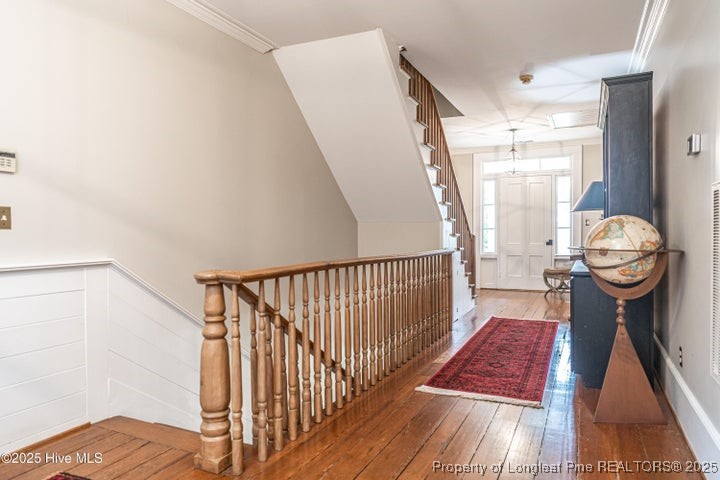 11102 Old Johns Road Laurinburg, NC 28352 - Photo 26 of 42 a view of a hallway to a livingroom with furniture and wooden floor