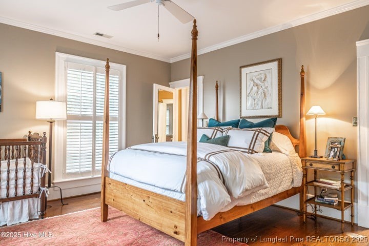 11102 Old Johns Road Laurinburg, NC 28352 - Photo 31 of 42 a bedroom with a bed and a lamp