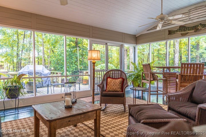 11102 Old Johns Road Laurinburg, NC 28352 - Photo 36 of 42 a living room with furniture and a floor to ceiling window