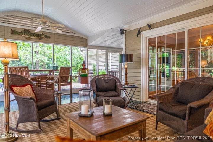 11102 Old Johns Road Laurinburg, NC 28352 - Photo 37 of 42 a living room with furniture and floor to ceiling windows