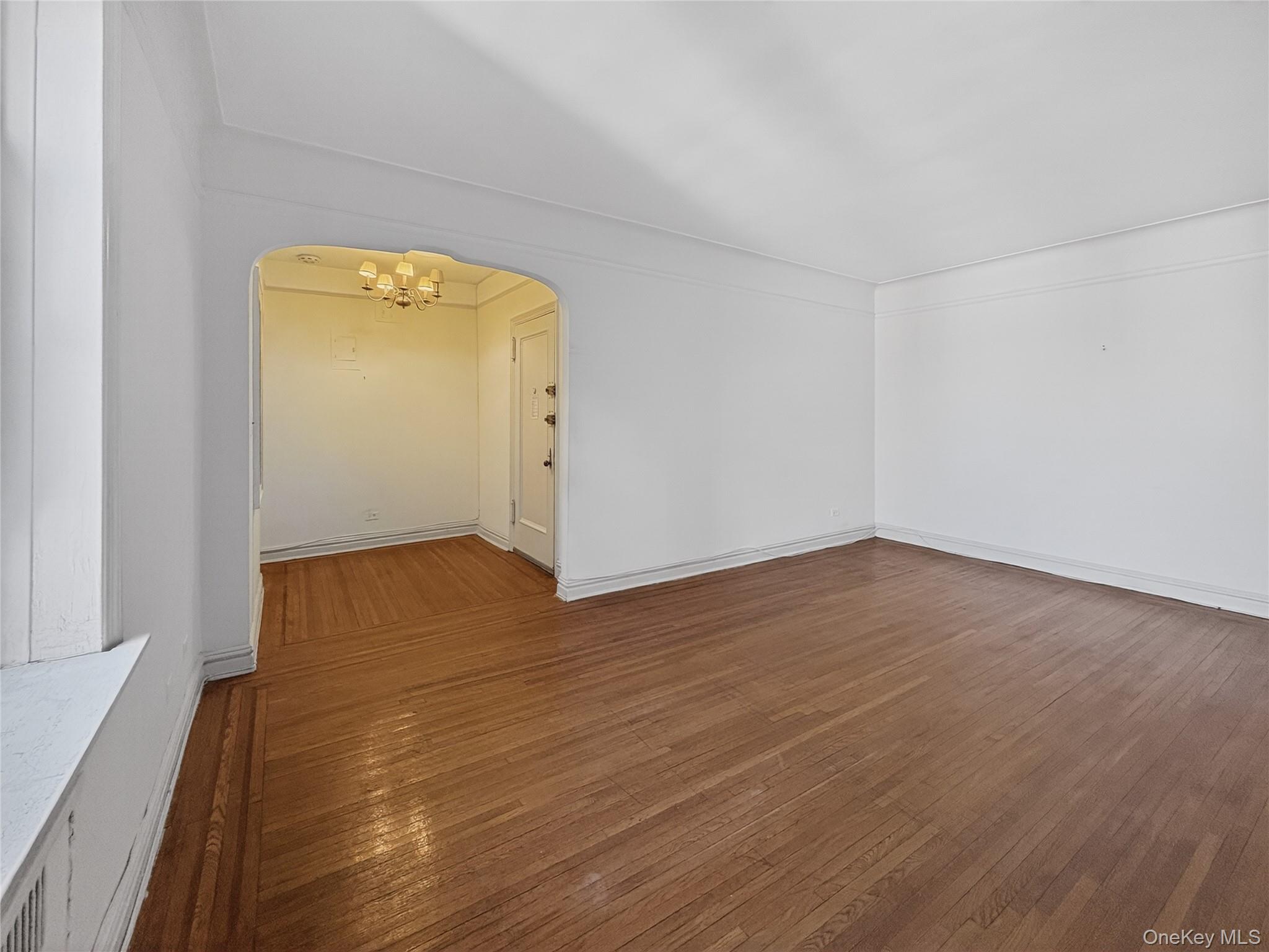45 Kew Gardens Road, Unit 5N Queens, NY 11415 - Photo 4 of 16 Living Room w/ view of entry foyer