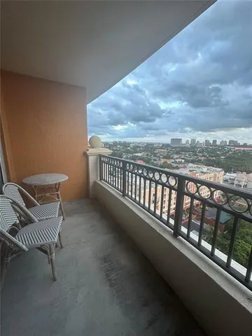 a view of balcony with furniture