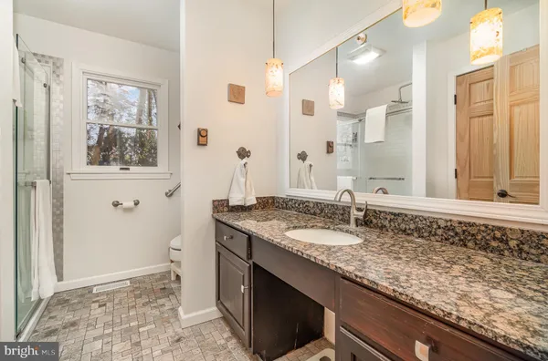 a bedroom with a bed and a view of bathroom