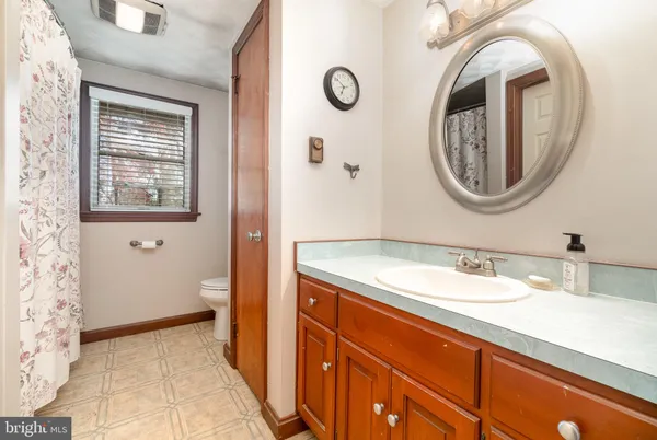 a front view of a house with a yard and outdoor seating