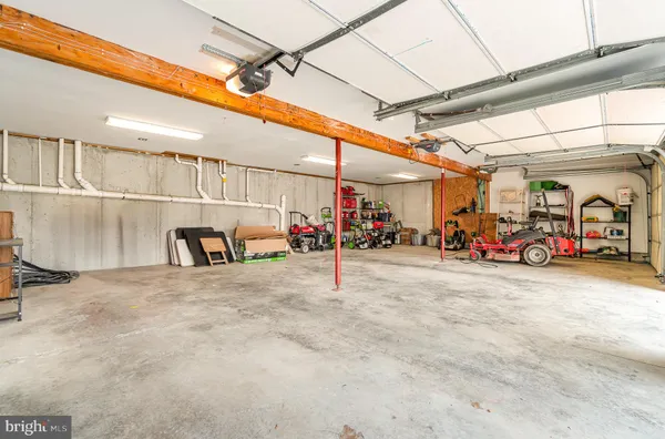 a view of a patio with a table and chairs