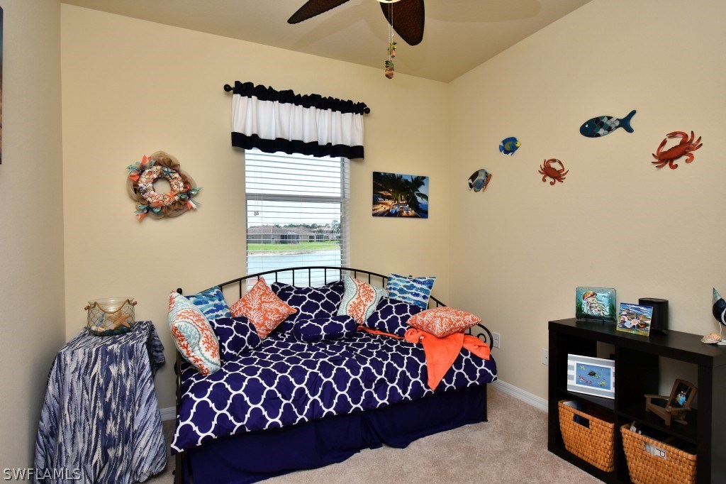11674 Eros Road Lehigh Acres, FL 33971 - Photo 19 of 35 a bedroom with a bed and a window