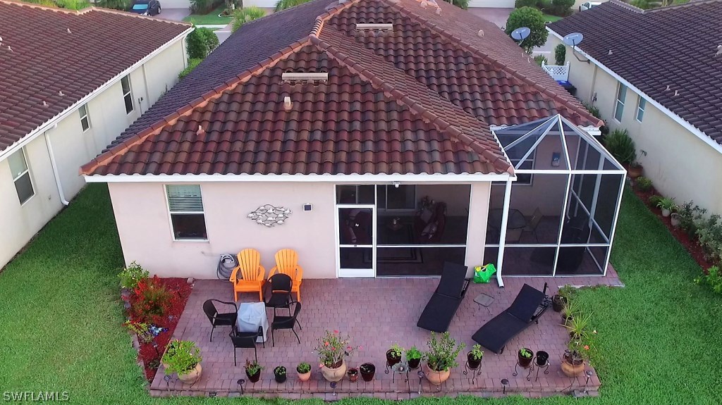 11674 Eros Road Lehigh Acres, FL 33971 - Photo 27 of 35 an aerial view of house with swimming pool and patio