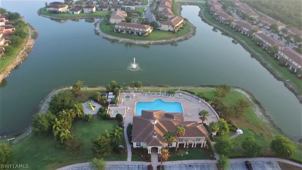 11674 Eros Road Lehigh Acres, FL 33971 - Photo 34 of 35 an aerial view of a house with outdoor space and lake view