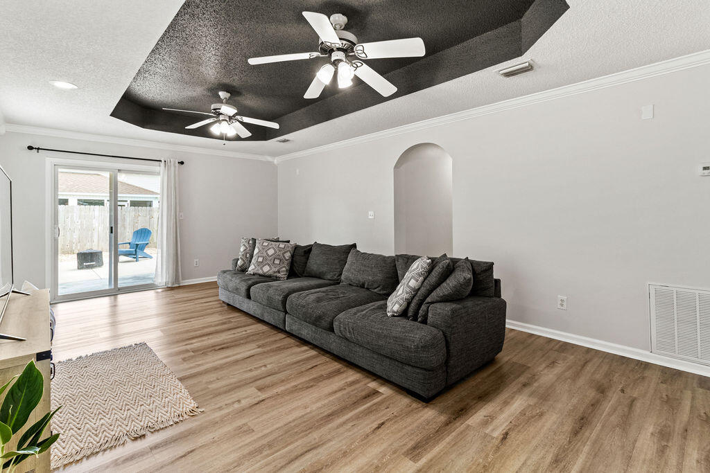 1791 Old Ranch Road Fort Walton Beach, FL 32547 - Photo 11 of 30 a living room with furniture and a ceiling fan