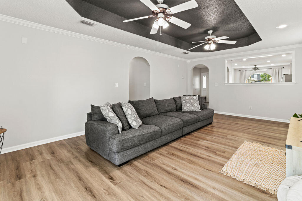 1791 Old Ranch Road Fort Walton Beach, FL 32547 - Photo 12 of 30 a living room with furniture and a ceiling fan