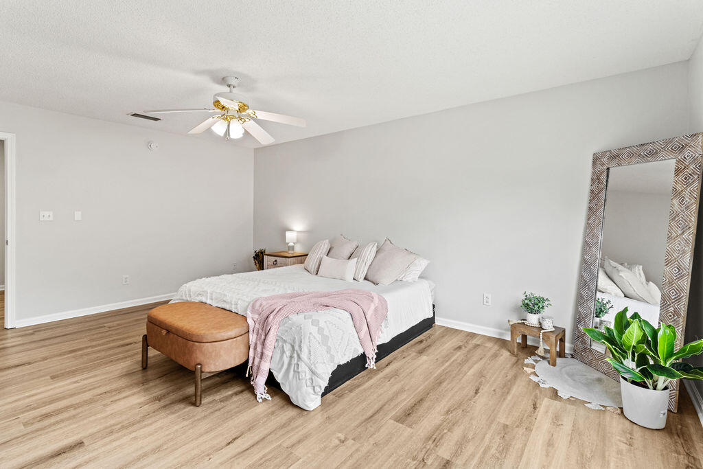 1791 Old Ranch Road Fort Walton Beach, FL 32547 - Photo 15 of 30 a bedroom with a bed and a chandelier