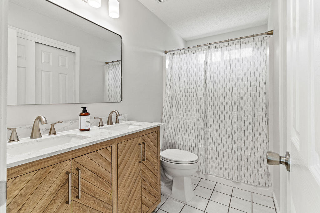 1791 Old Ranch Road Fort Walton Beach, FL 32547 - Photo 18 of 30 a bathroom with a sink a toilet and shower