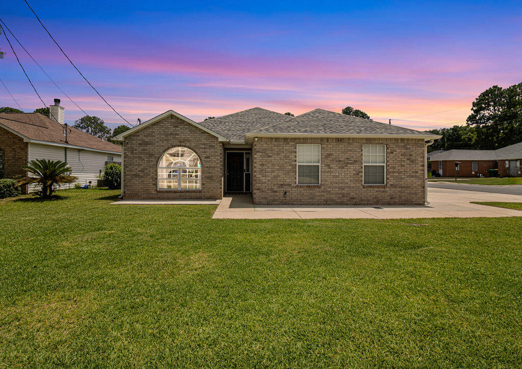 1791 Old Ranch Road Fort Walton Beach, FL 32547 - Photo 2 of 30 a front view of a house with a garden