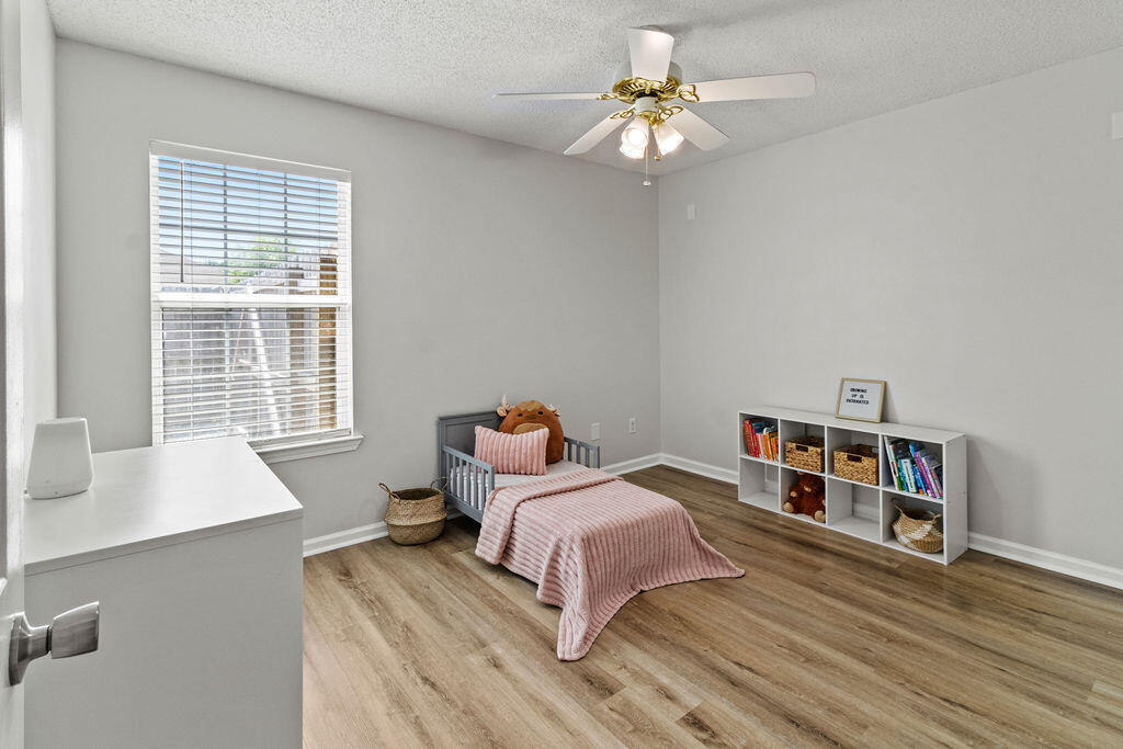 1791 Old Ranch Road Fort Walton Beach, FL 32547 - Photo 21 of 30 a bedroom with a bed furniture and a window