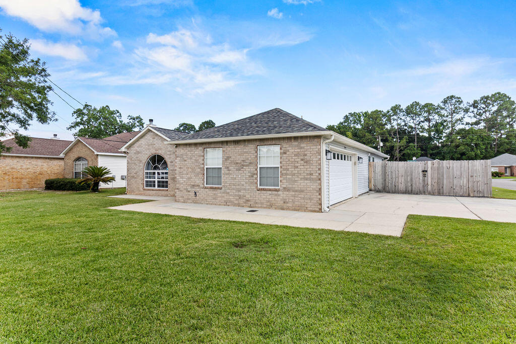 1791 Old Ranch Road Fort Walton Beach, FL 32547 - Photo 3 of 30 a front view of a house with yard