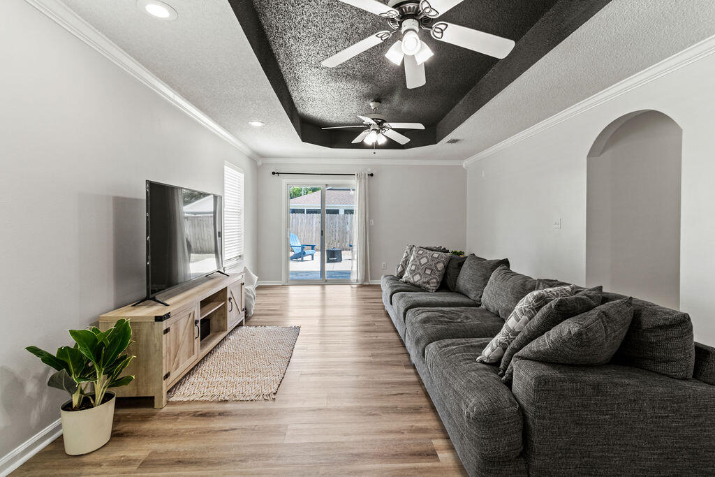 1791 Old Ranch Road Fort Walton Beach, FL 32547 - Photo 10 of 30 a living room with furniture and a flat screen tv