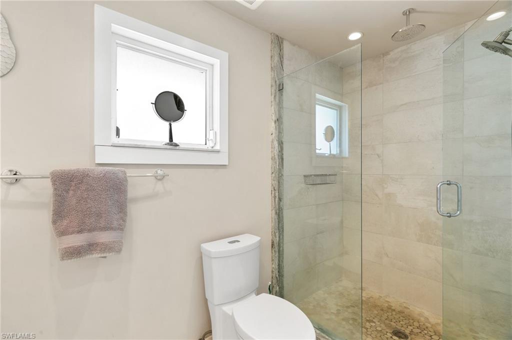 2140 Shad Court Naples, FL 34102 - Photo 42 of 44 a bathroom with a toilet sink and shower