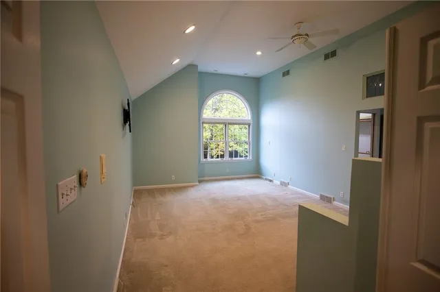 a view of an empty room and window