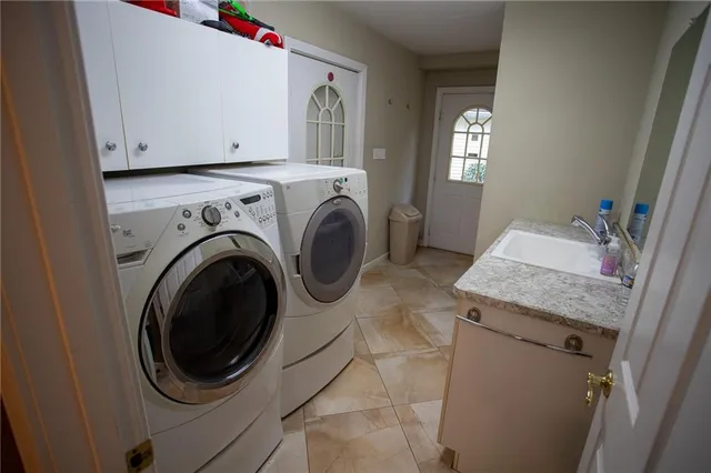 a utility room with dryer and washer