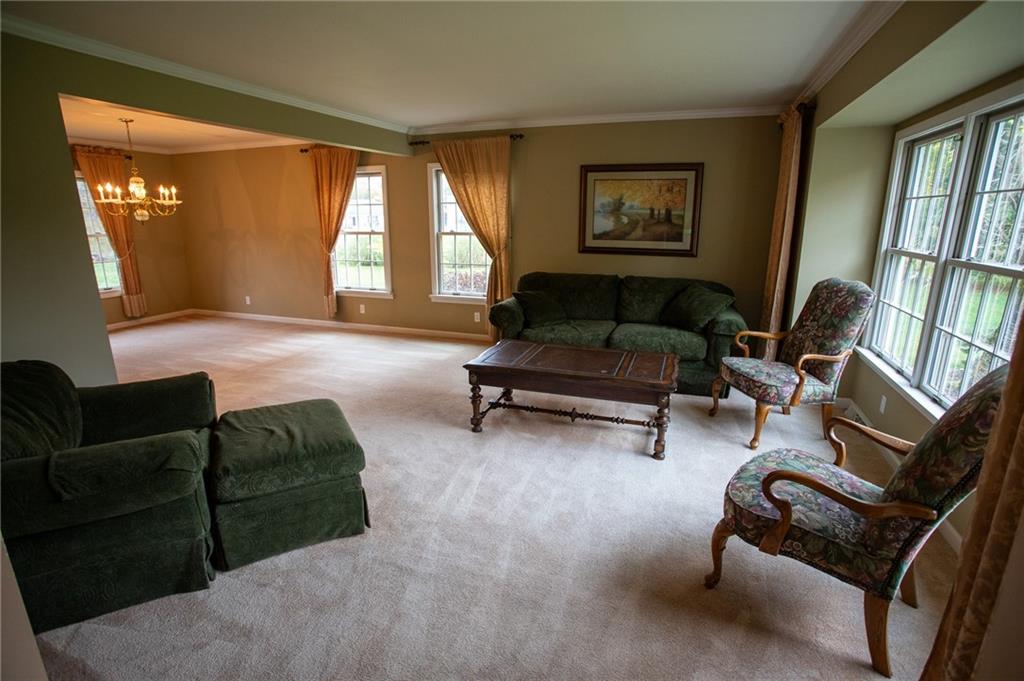357 Morningstar Lane Neshannock, PA 16105 - Photo 10 of 25 a living room with furniture and a large window