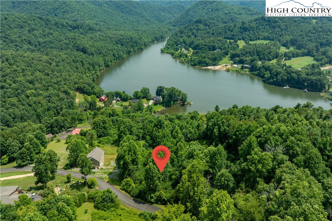 Lot 10 Lake Ridge Butler, TN 37640 - Photo 15 of 24 an aerial view of a house with a yard and lake view