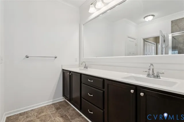 a bathroom with a sink vanity and mirror