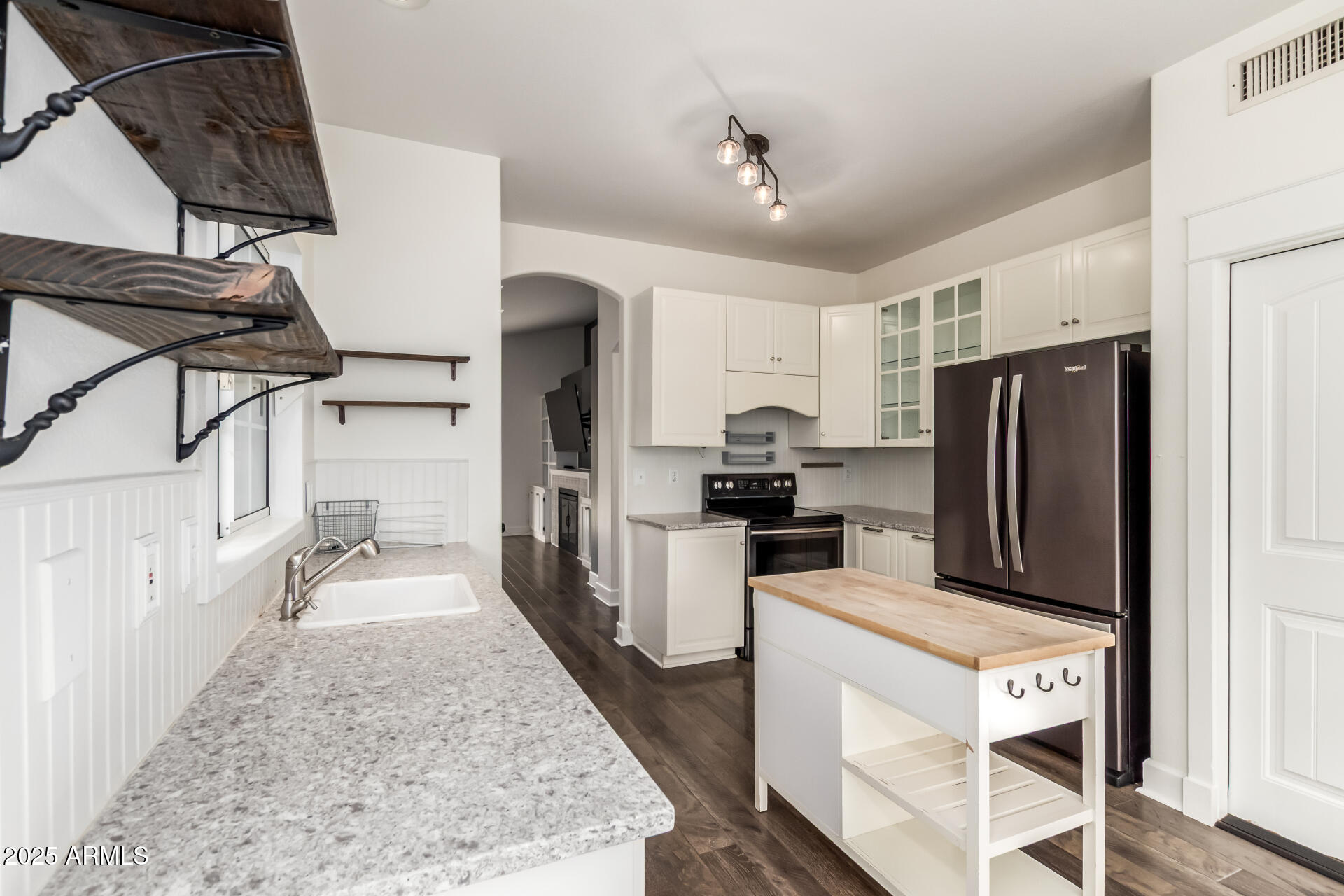1132 North Hudson Place Chandler, AZ 85225 - Photo 13 of 34 a kitchen with refrigerator and cabinets