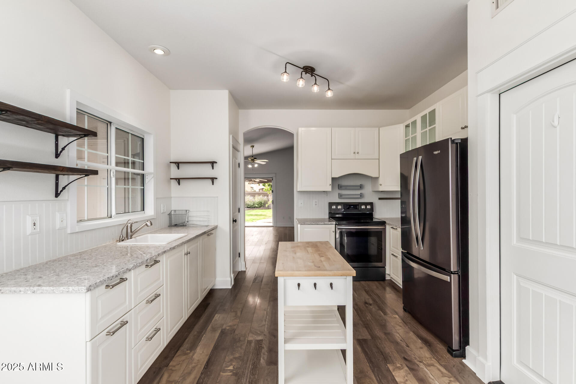 1132 North Hudson Place Chandler, AZ 85225 - Photo 14 of 34 a kitchen with a refrigerator and a sink
