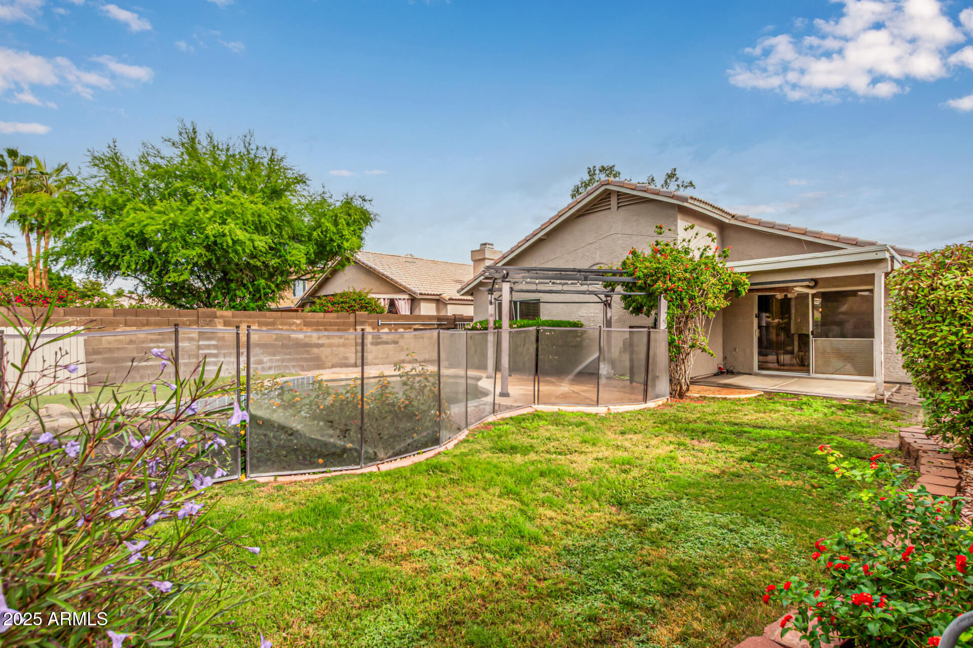 1132 North Hudson Place Chandler, AZ 85225 - Photo 29 of 34 a view of a house with a backyard and a garden