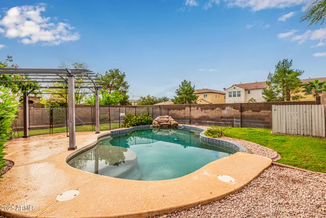 a view of a swimming pool with a lounge chairs