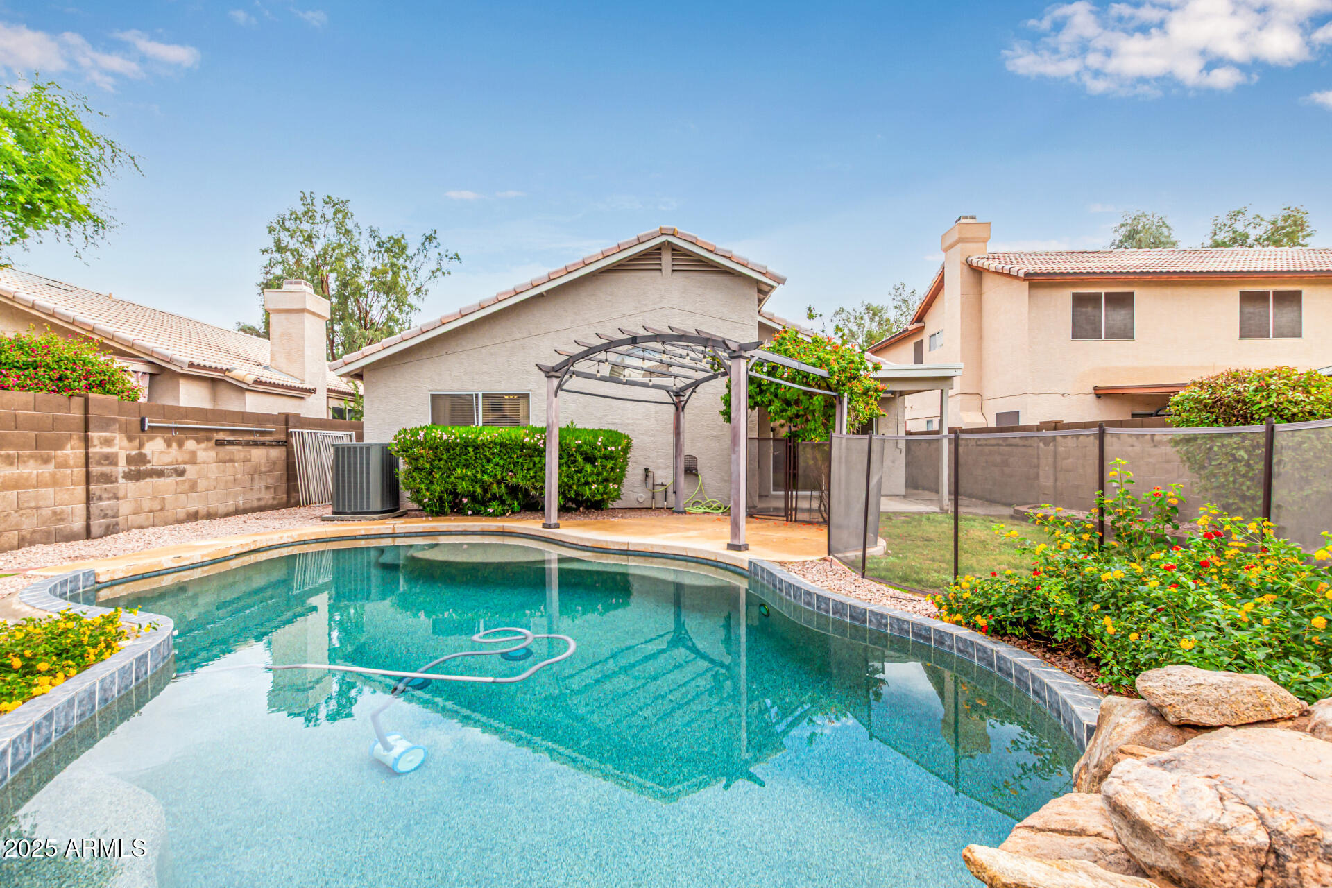 1132 North Hudson Place Chandler, AZ 85225 - Photo 33 of 34 a swimming pool with yard outdoor seating and yard in the back