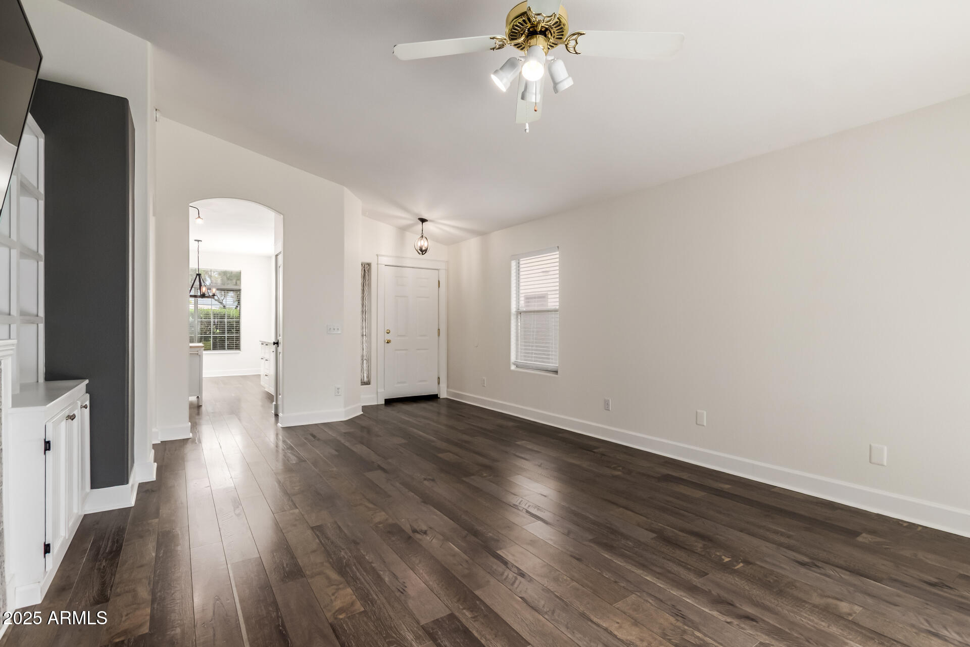 1132 North Hudson Place Chandler, AZ 85225 - Photo 9 of 34 wooden floor in an empty room with a window