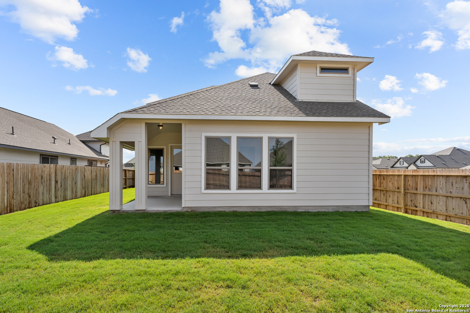 119 Mallorys Way Castroville, TX 78009 - Photo 4 of 24 a front view of a house with a yard and garage