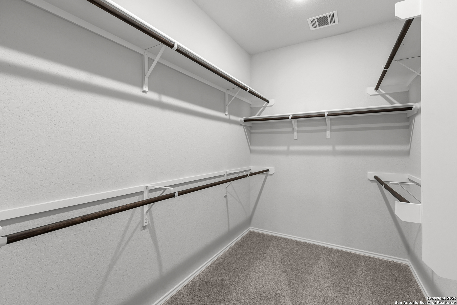 119 Mallorys Way Castroville, TX 78009 - Photo 8 of 24 a view of an empty walk in closet