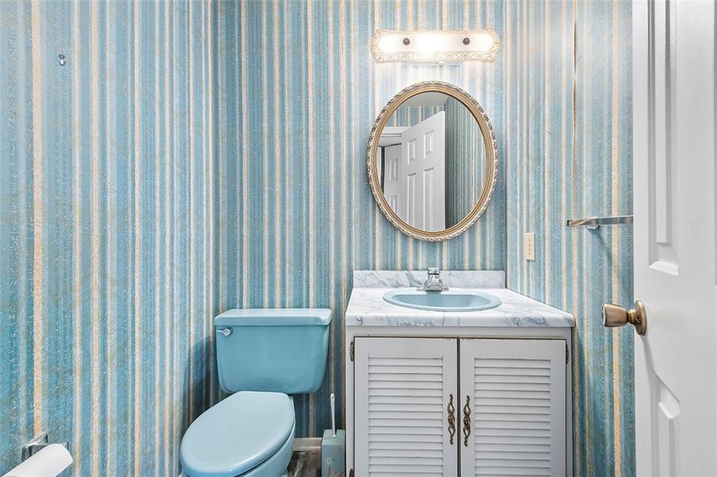 1619 Tiffany Ridge Drive Pittsburgh, PA 15241 - Photo 14 of 25 a bathroom with a sink a toilet and a mirror