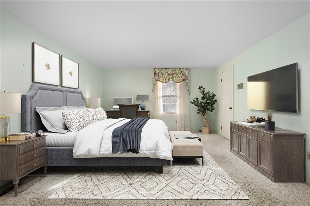 1619 Tiffany Ridge Drive Pittsburgh, PA 15241 - Photo 15 of 25 a bedroom with a bed and a flat screen tv