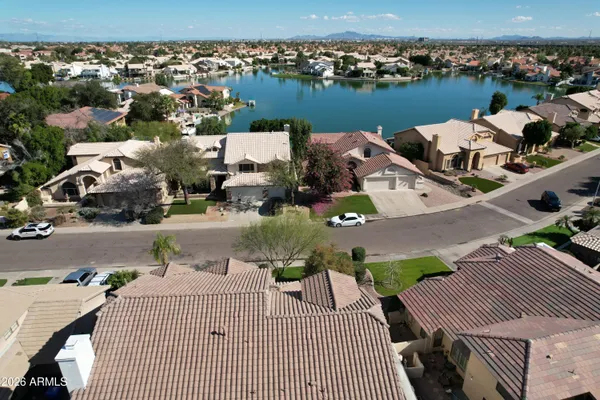 an aerial view of a house with outdoor space
