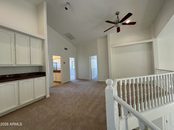 a view of hallway with chandelier