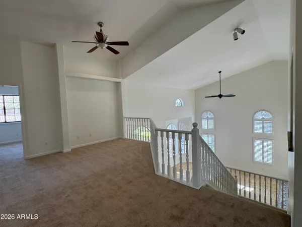 a view of a hallway with windows