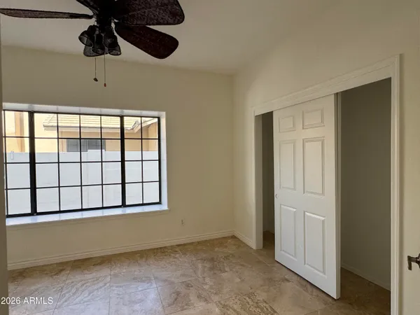 a view of an empty room with a window