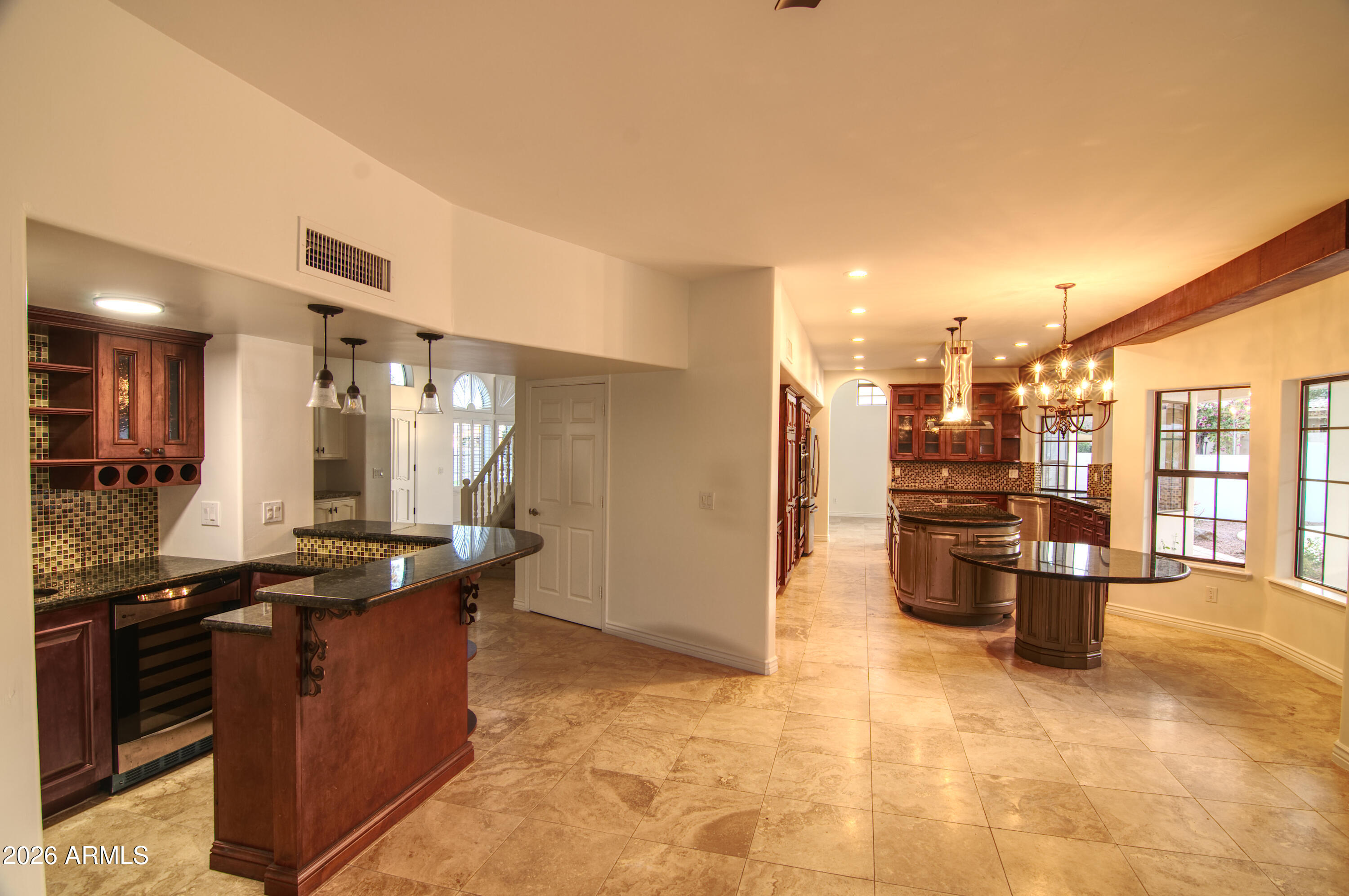 16006 South 36th Street Phoenix, AZ 85048 - Photo 7 of 47 Family Room and Bar adjacent to Kitchen