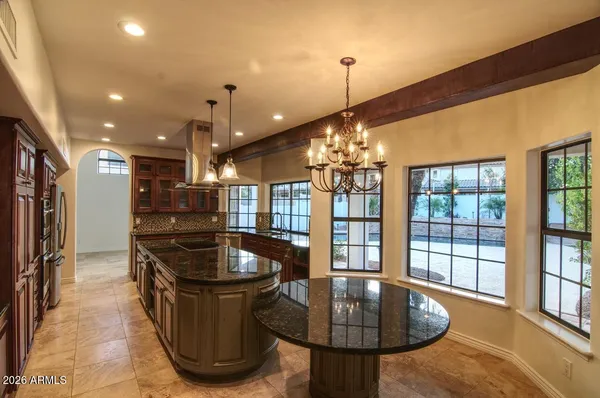 a kitchen with a sink and lots of appliances