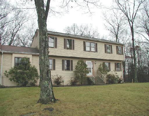 6 Timbermill Road Newtown, CT 06482 - Photo 1 of 1 a front view of a house with garden