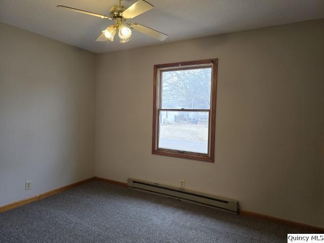 219 South 1st Street Carthage, IL 62321 - Photo 8 of 28 an empty room with a window